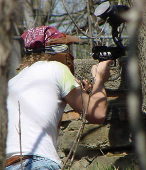 Ben Schaben in a hole in the ground and aiming right